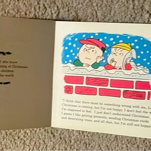 Charlie Brown Christmas book with ornament .